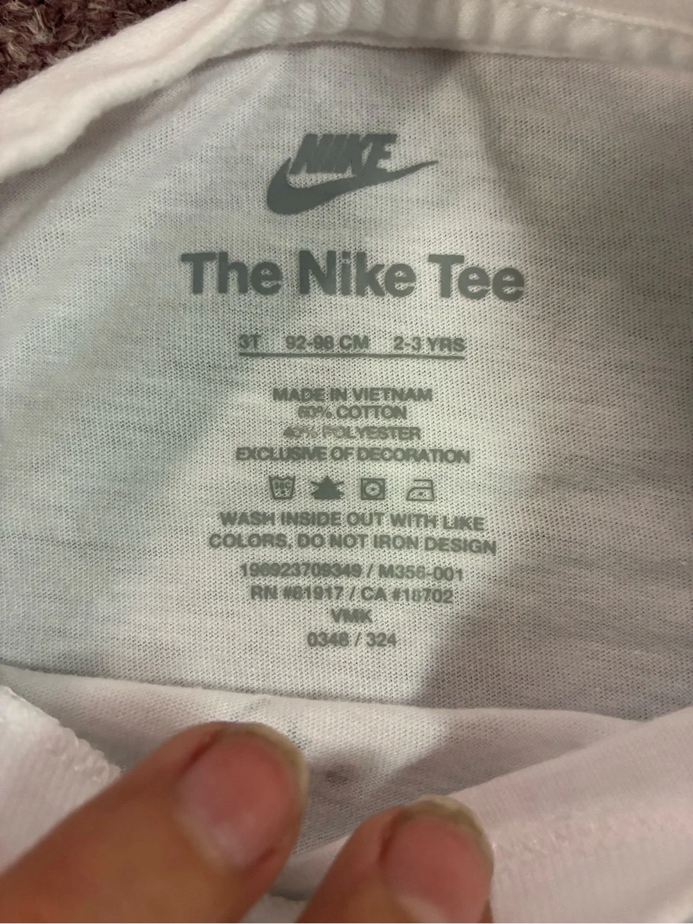 Nike White Long-Sleeve Tee with Colorful 'Just Do It' Character Graphic